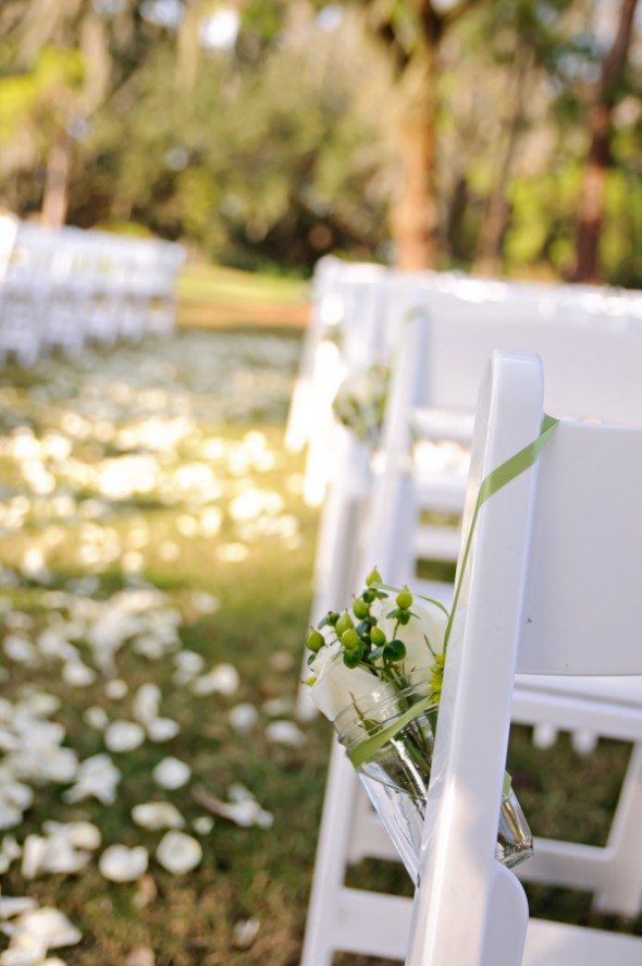 Hanging Mason Jars From Chairs At Wedding