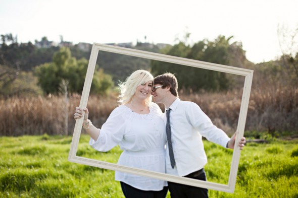 Picture frame used as prop at engagement session