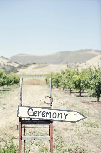 Ceremony sign from Hugs & Kisses Events