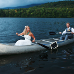 A bride and groom in a canoe